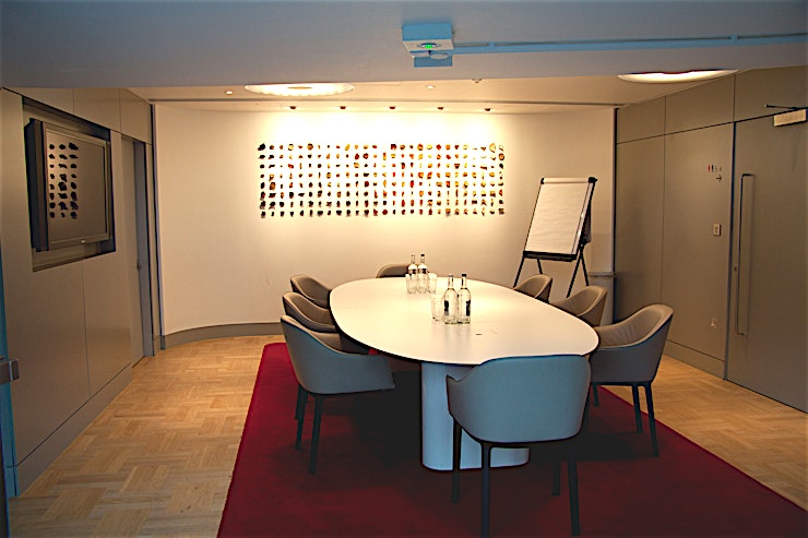 Terrace Boardroom **The Terrace Boardroom is an exclusive room boasting a stylish archaeological display.**
Perfect for intimate meetings, it also has a built-in plasma screen which can be linked to a laptop for pres